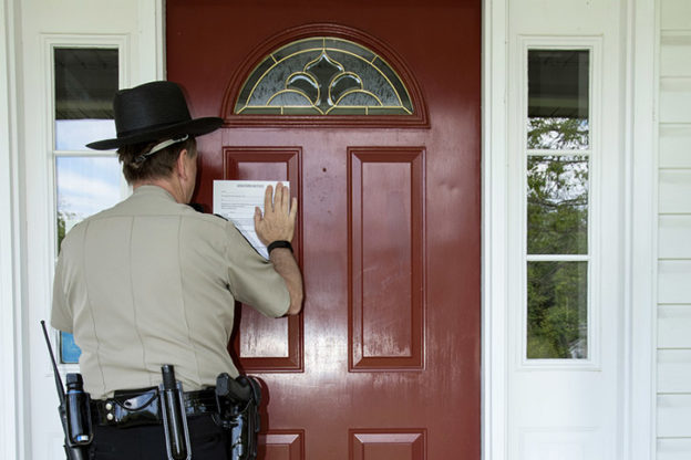 Officer at residence for physical eviction